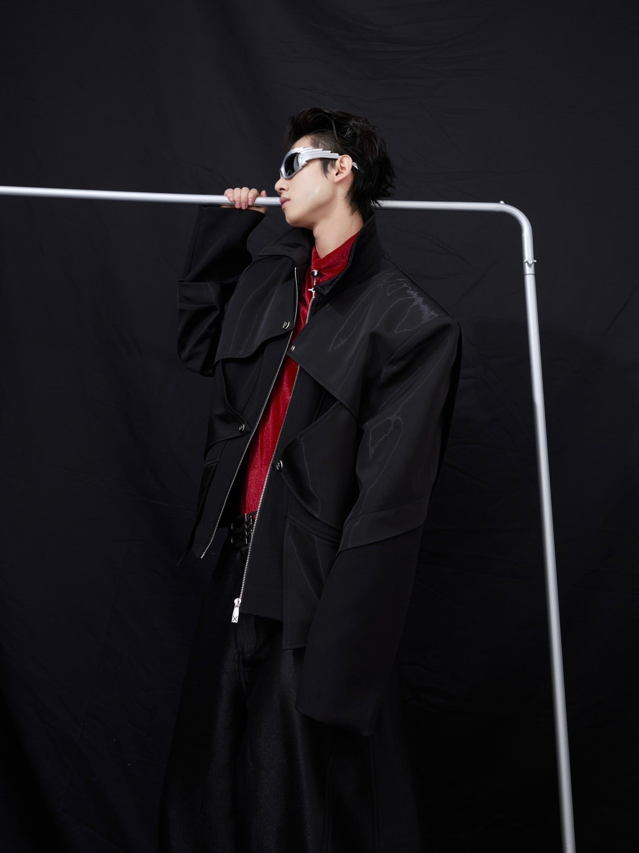 Front angle showing intentionally dislocated visual effect of this dimensional tailored streetwear jacket