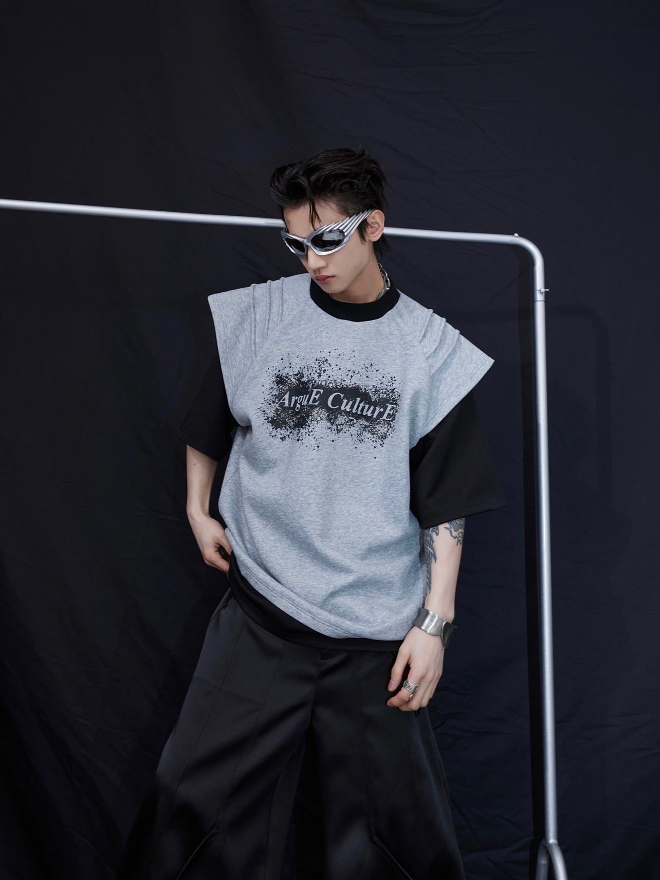 Close-up of the innovative spliced segmentation design on this statement streetwear t-shirt with deconstructed tailoring