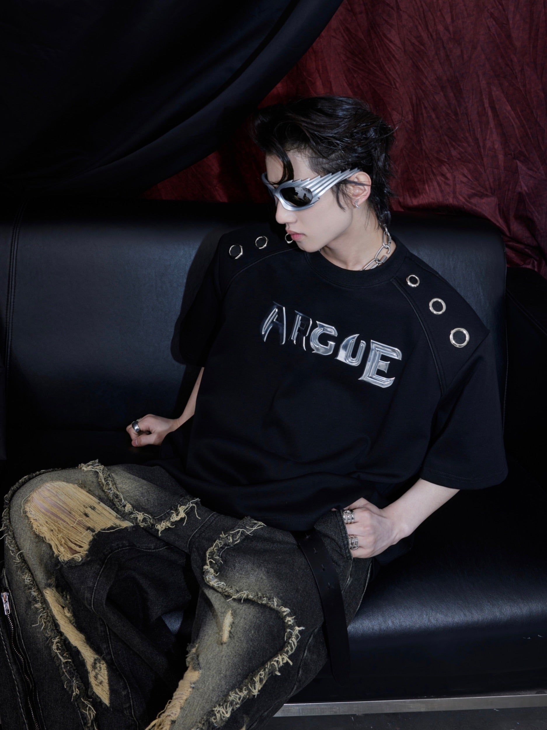Side angle showing unique deconstructed split design of this streetwear-inspired graphic logo tee
