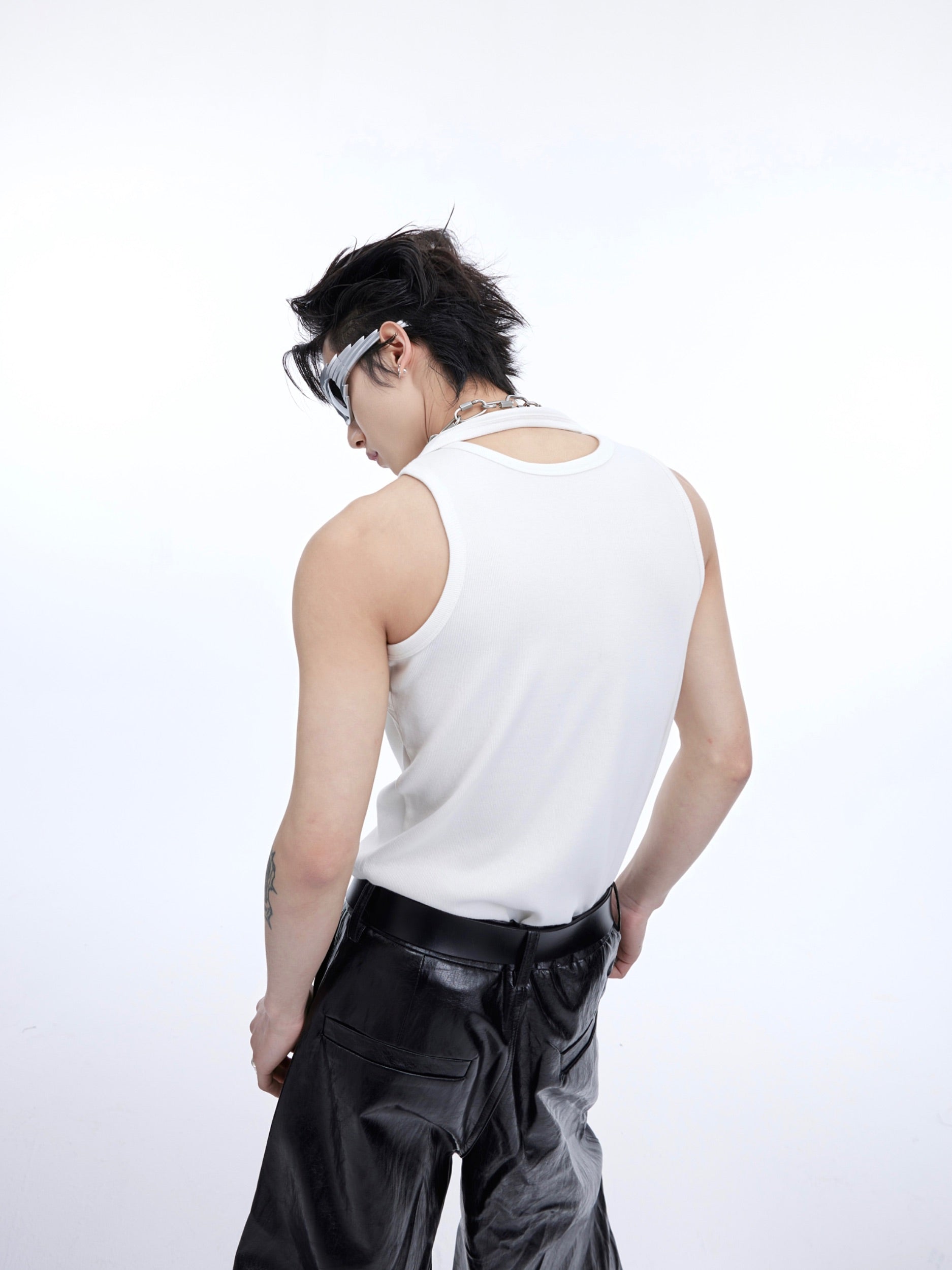 Side angle showing the unique deconstructed design and ribbed texture of this fashion-forward women's tank top