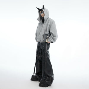 Close-up of metallic stud embellishments on urban edge hoodie for fashion-forward statement