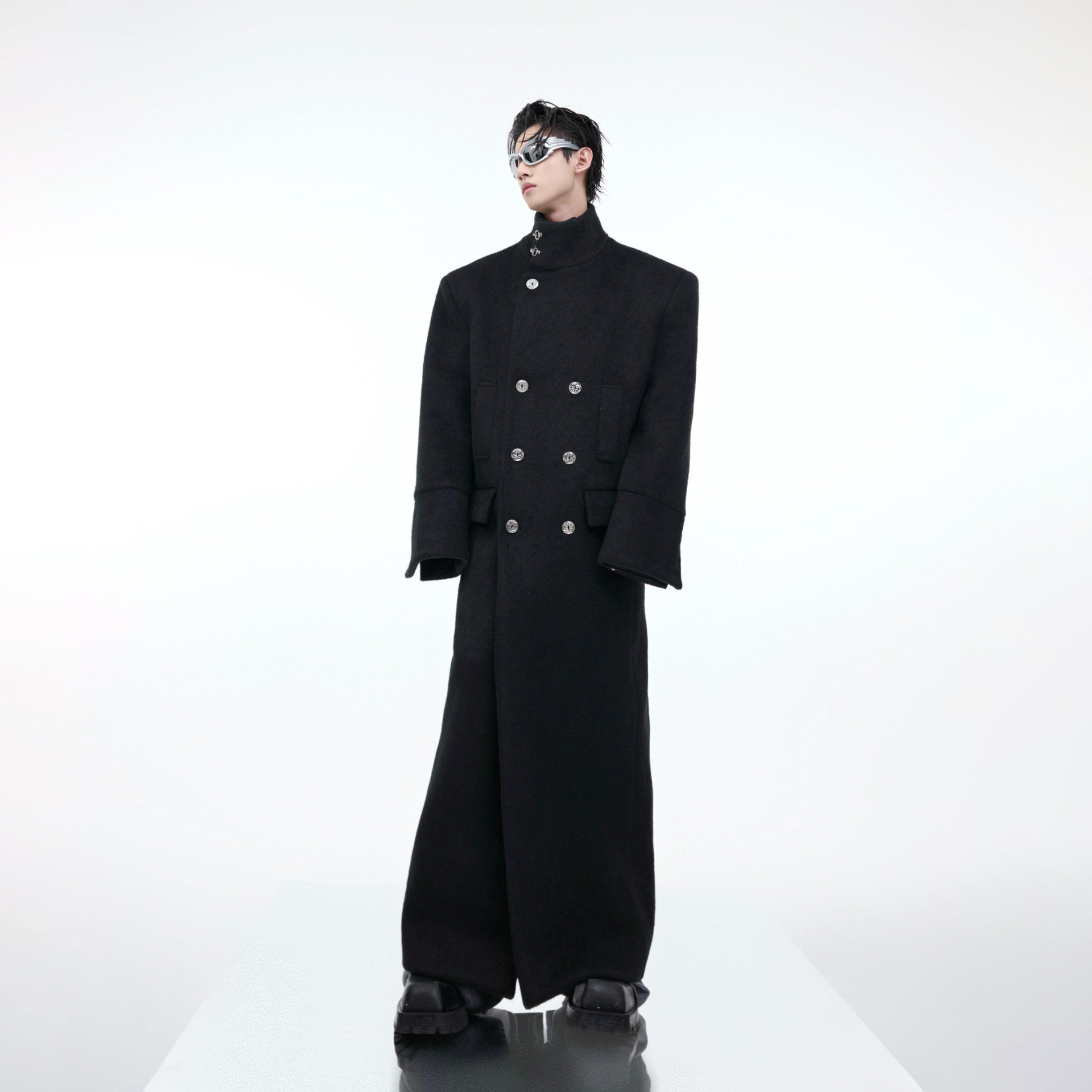 Detail shot showing premium wool fabric and functional pockets on long trench coat