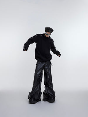Back view of fashion-forward oversized knit sweater creating bold urban silhouette