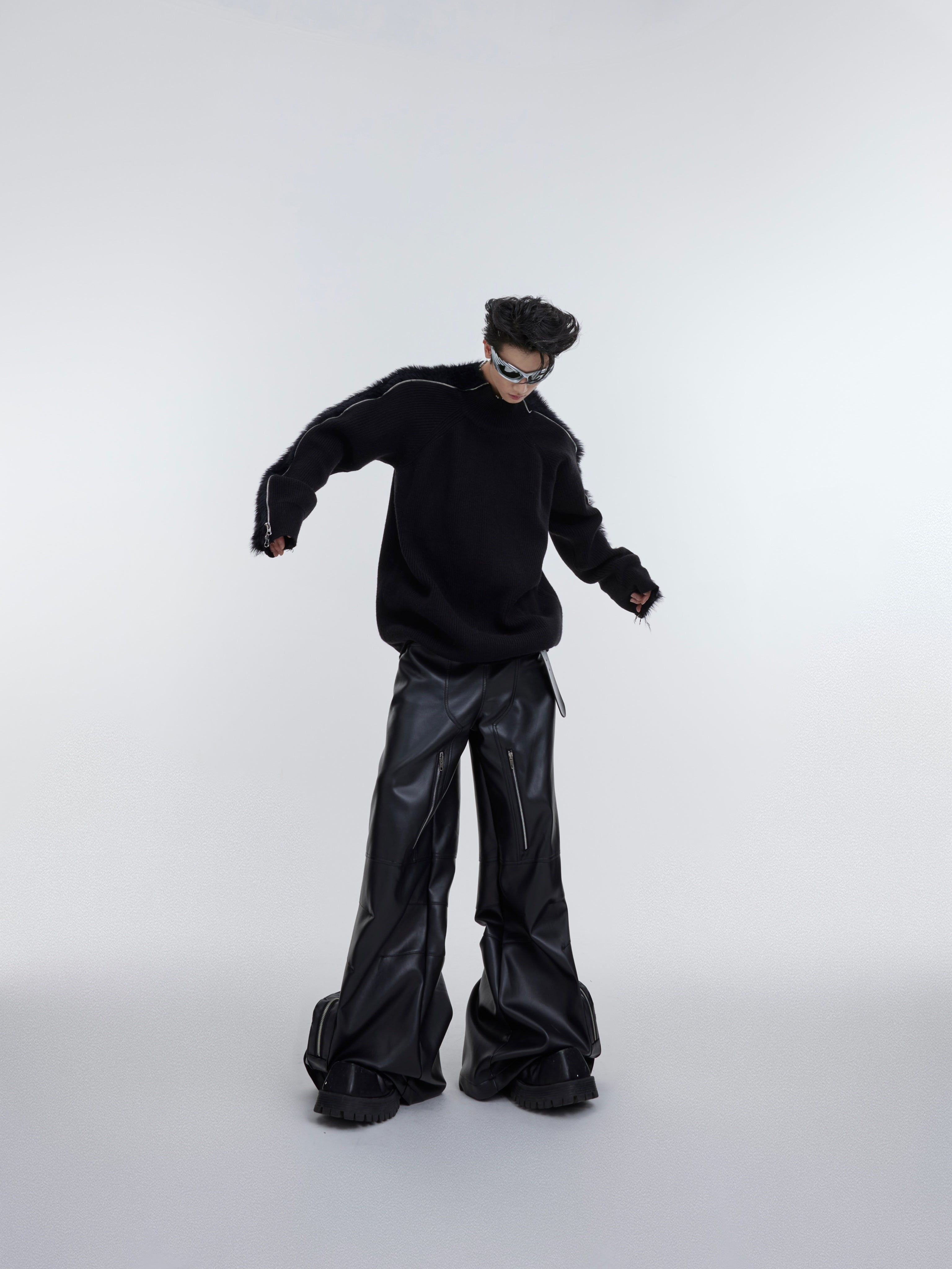 Back view of fashion-forward oversized knit sweater creating bold urban silhouette