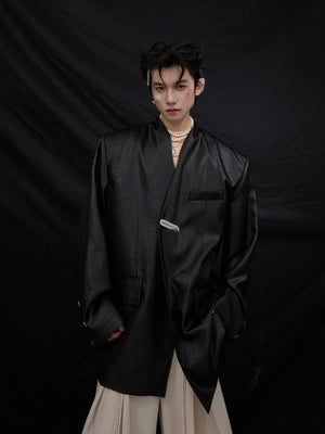 Back view of oversized blazer with striking liquid metal texture and bold silhouette for urban street style