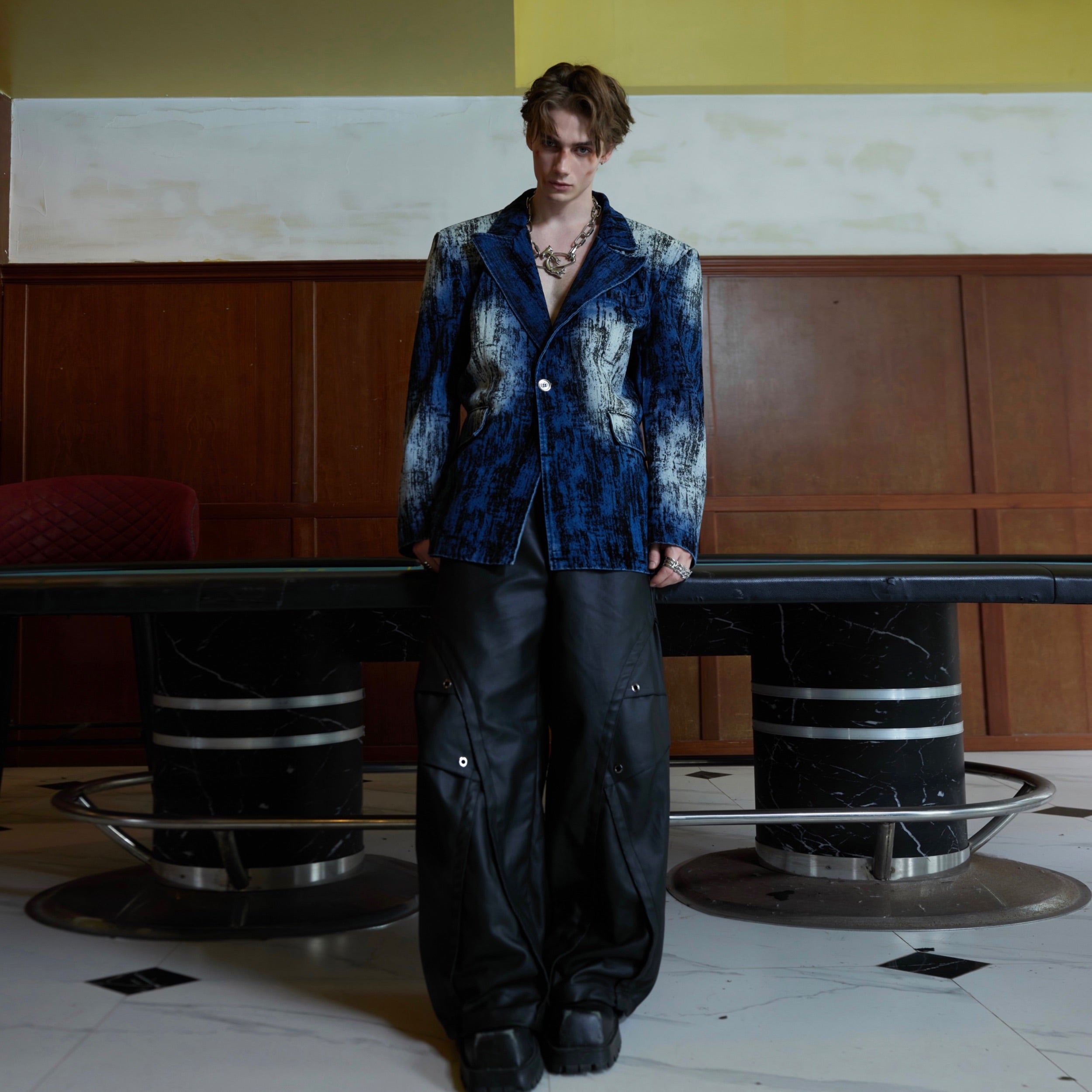 Side profile showing the relaxed oversized fit of this vintage-inspired tie-dye denim jacket
