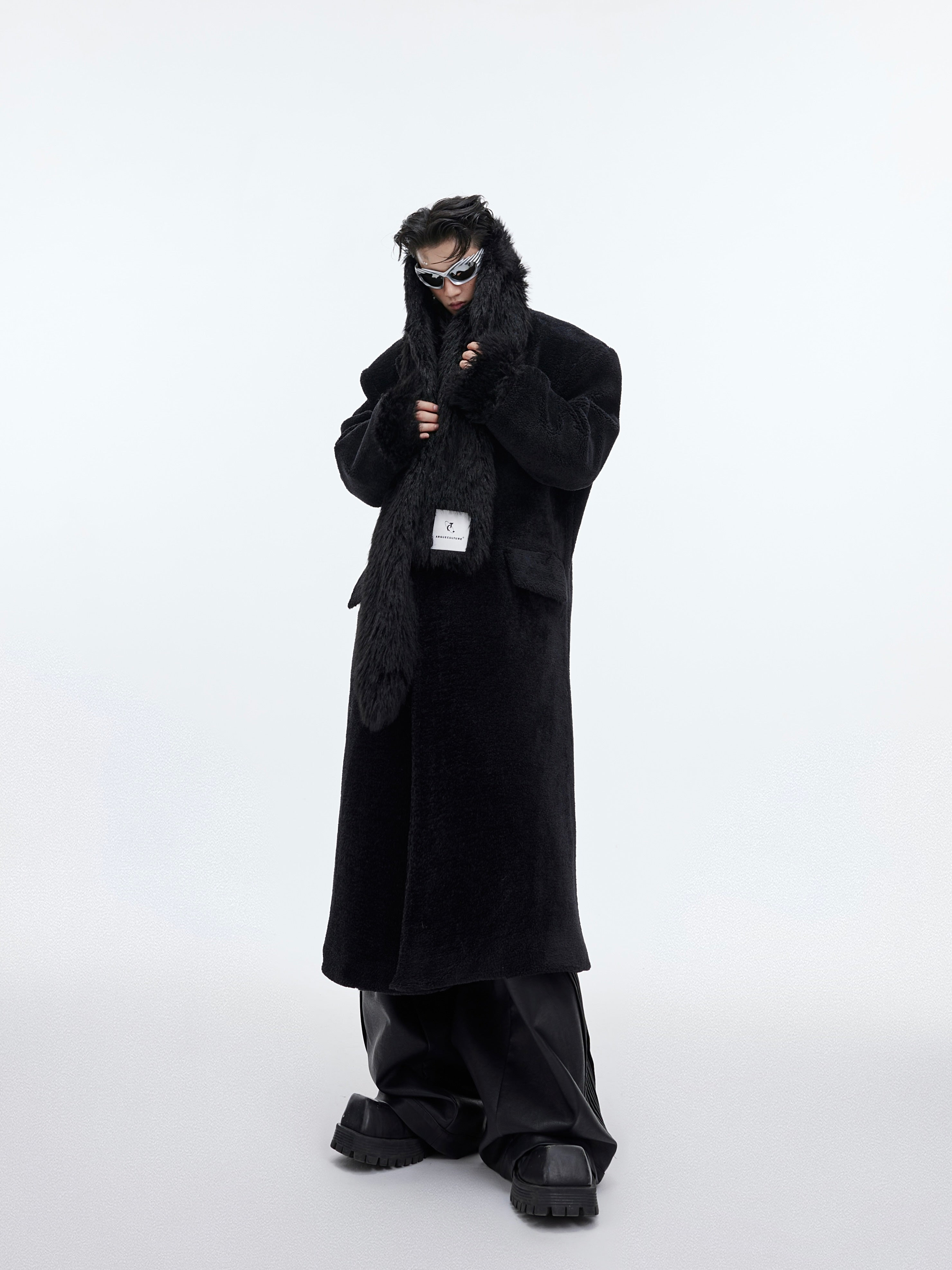 Male model wearing oversized tweed coat showing the perfect drape and relaxed streetwear silhouette
