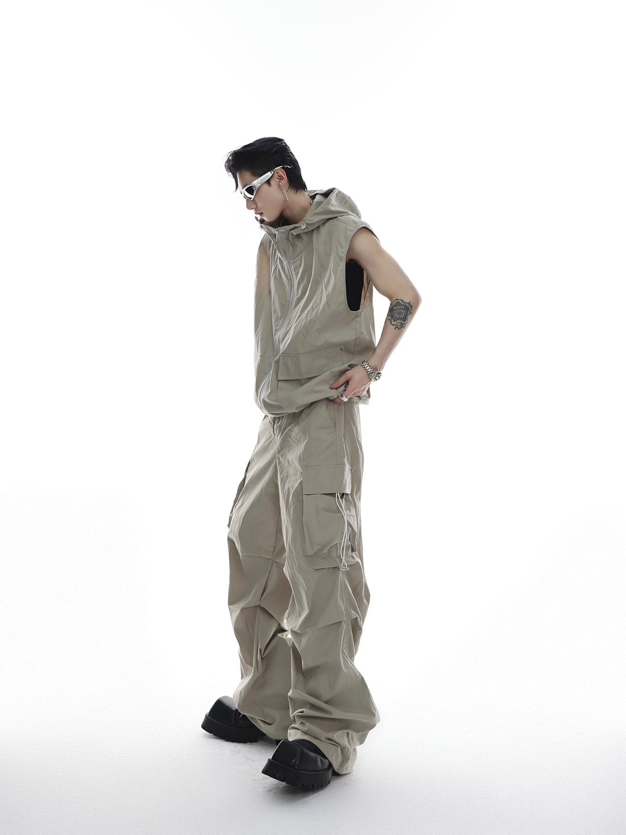 Post-apocalyptic streetwear crop top with asymmetrical zipper details and height-enhancing design