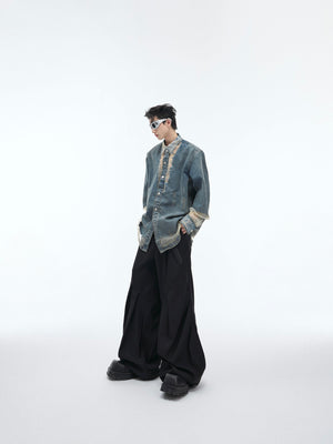 Styling example of deconstructed denim shirt layered over basic tee, showcasing urban fashion versatility