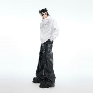 Fashion model wearing the oversized glitter-detailed hoodie showing perfect spring streetwear look
