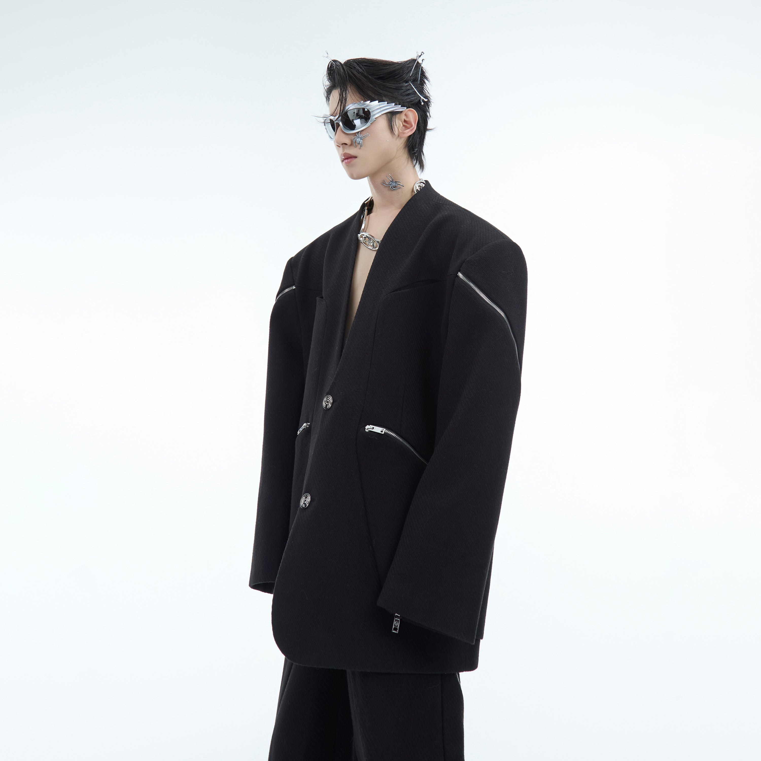 Side angle showing slim fit of modern no collar blazer with unique deconstructed design and premium fabric