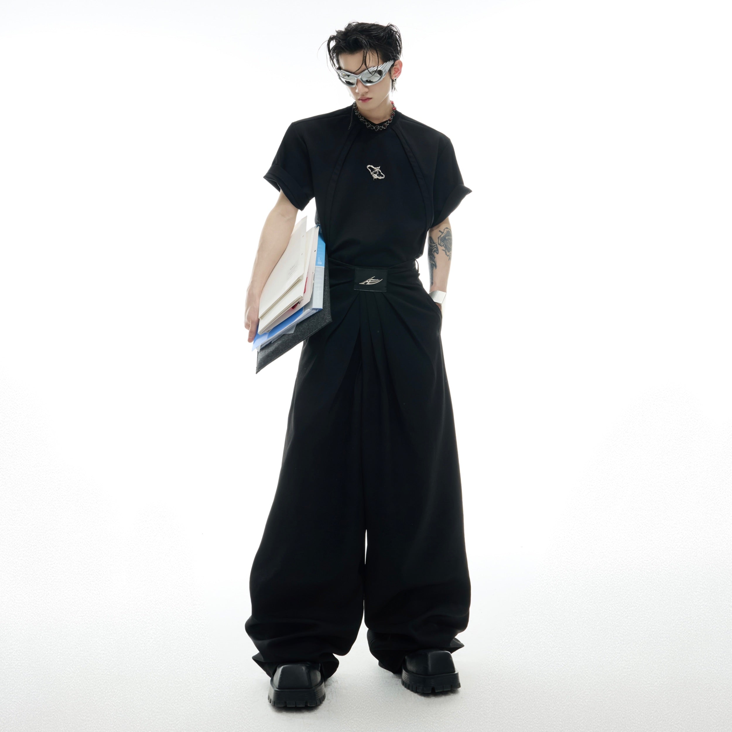 Streetwear essential pants featuring bold geometric waistband statement and wide-leg silhouette