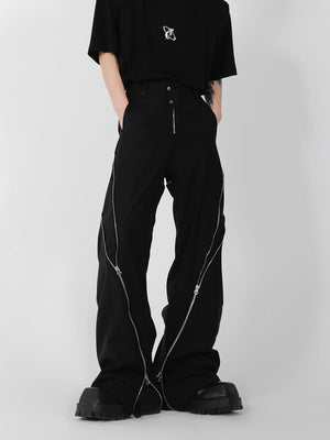 Side view of distressed flared pants showing the urban streetwear silhouette and premium fabric drape