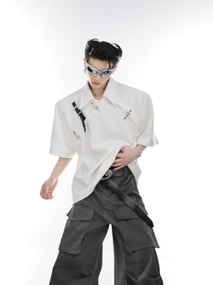 Male model wearing deconstructed polo shirt with metal buckle, showing full front design