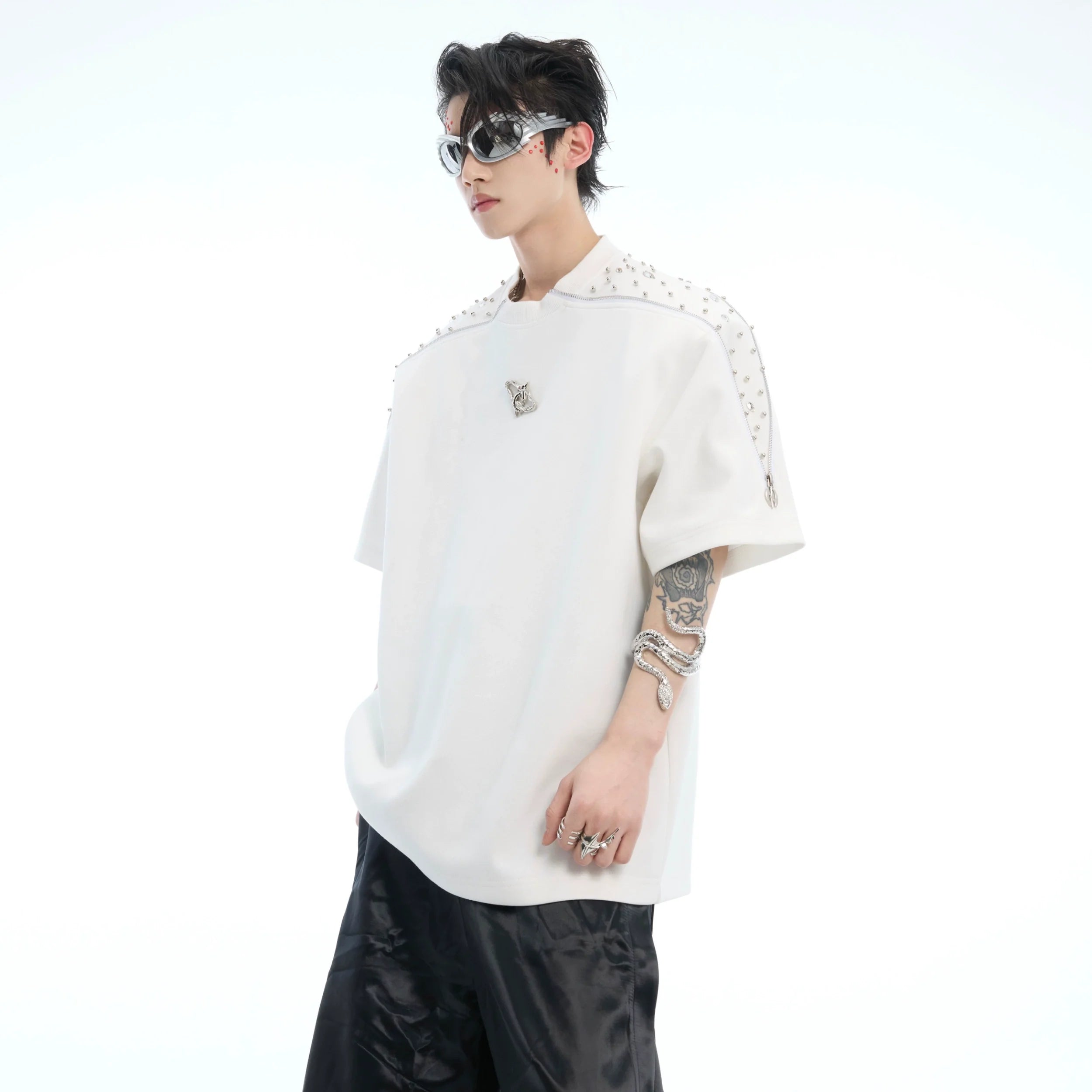 Front view of oversized rhinestone zip tee with deconstructed metal zipper detailing on round neck t-shirt
