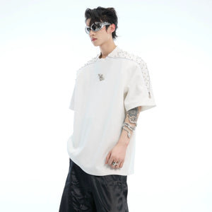 Front view of oversized rhinestone zip tee with deconstructed metal zipper detailing on round neck t-shirt