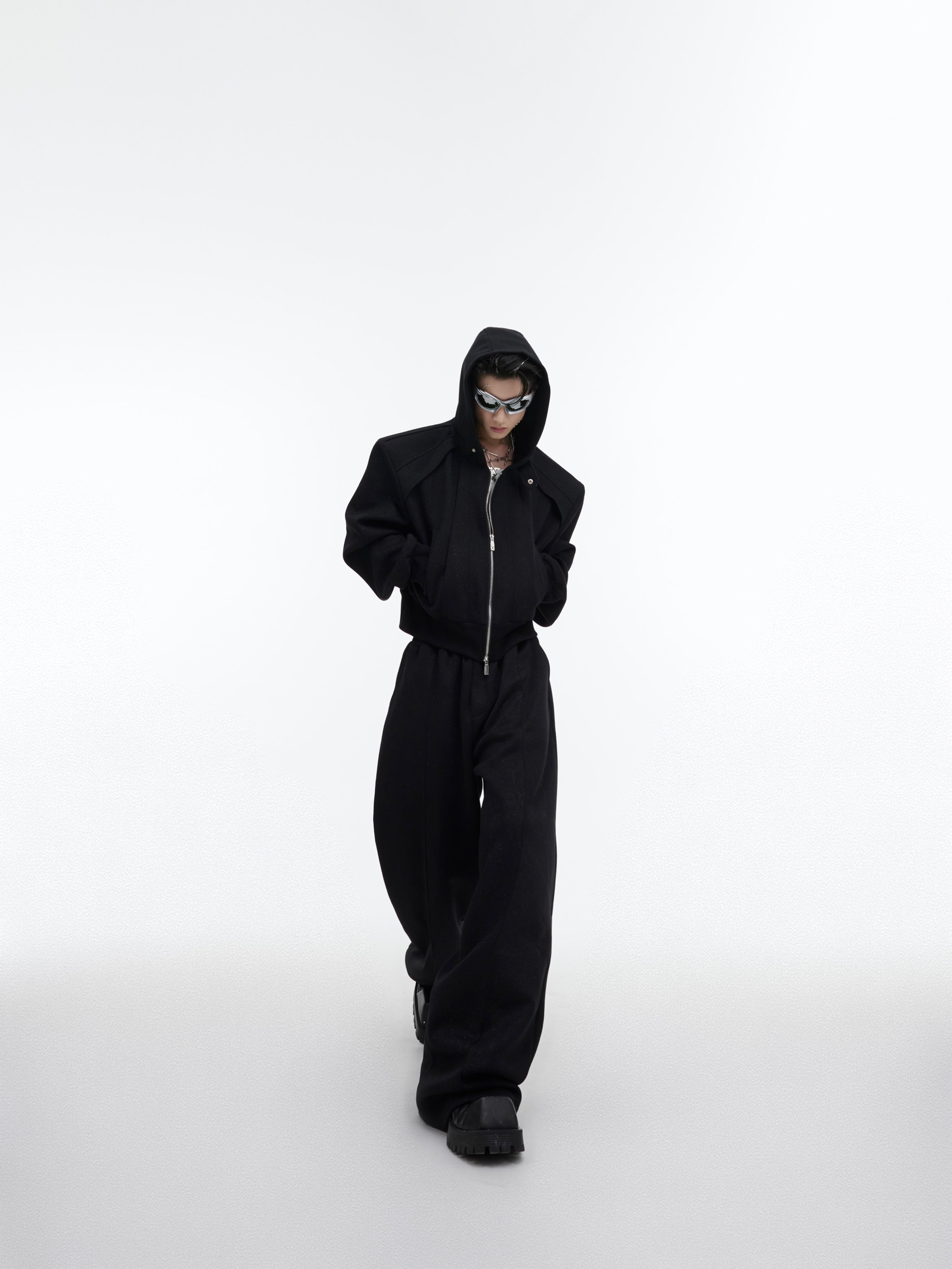 Flat lay composition showing complete cropped hoodie and pants set with subtle sparkle fabric