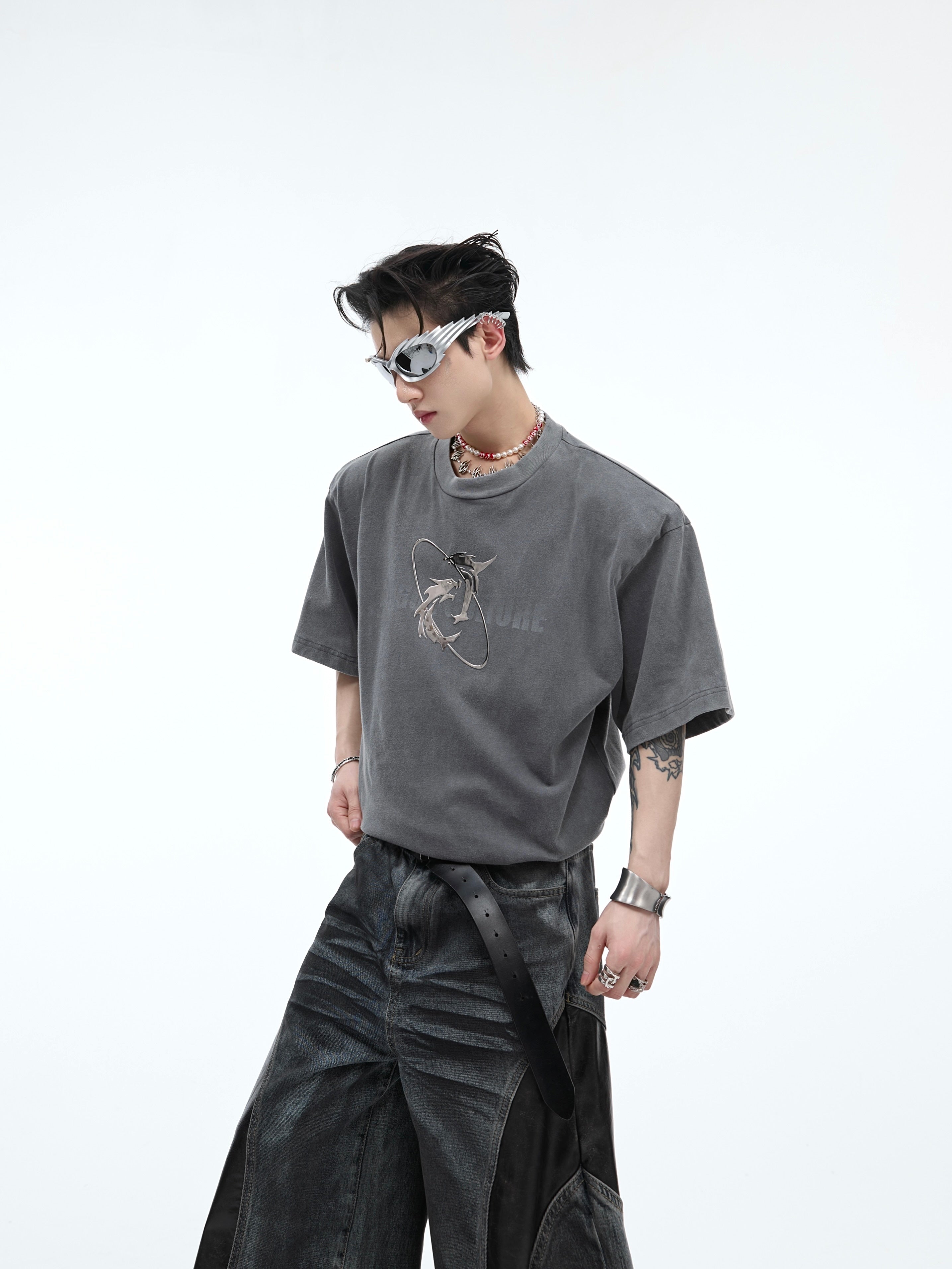 Front view of vintage washed graphic tee on model showing relaxed fit and distressed shoulder design
