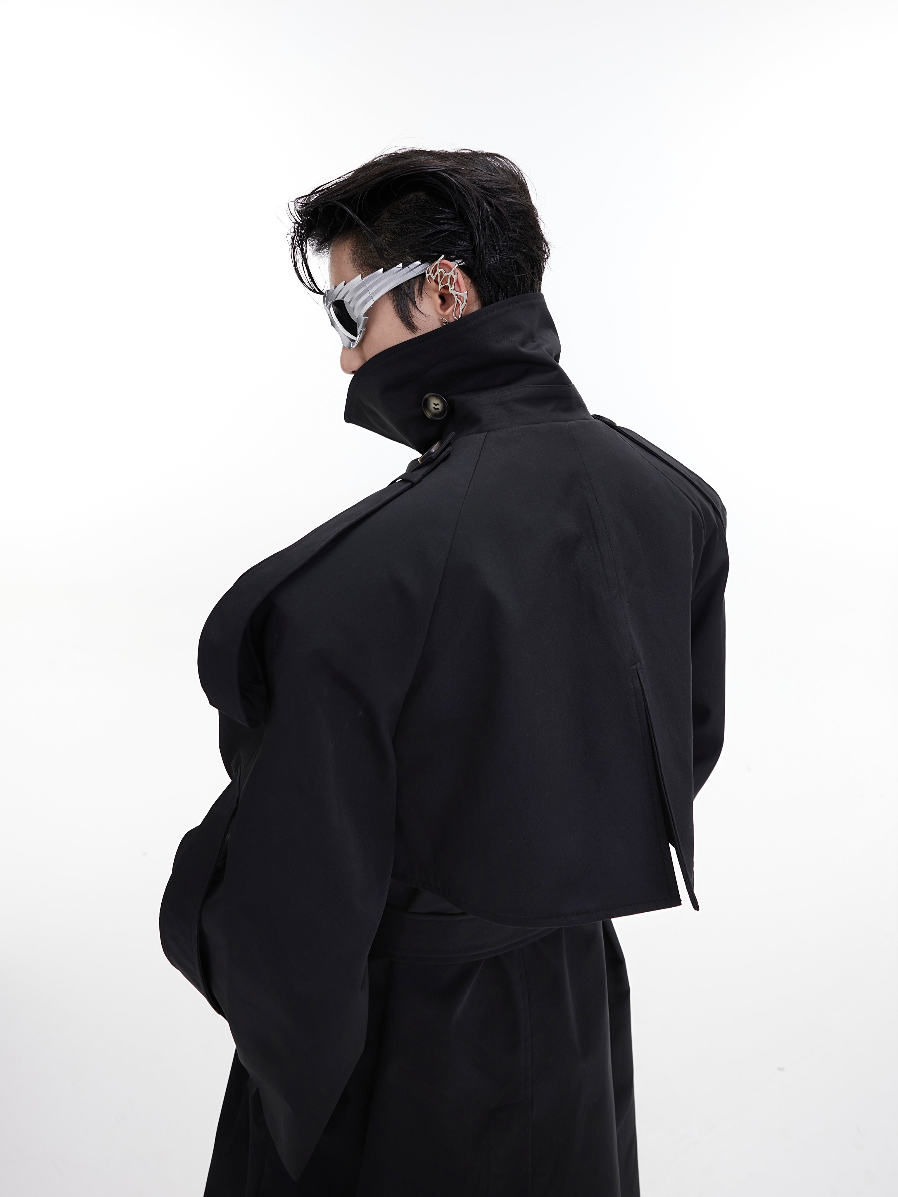 Back view of deconstructed trench coat with architectural details, perfect for elevated streetwear looks