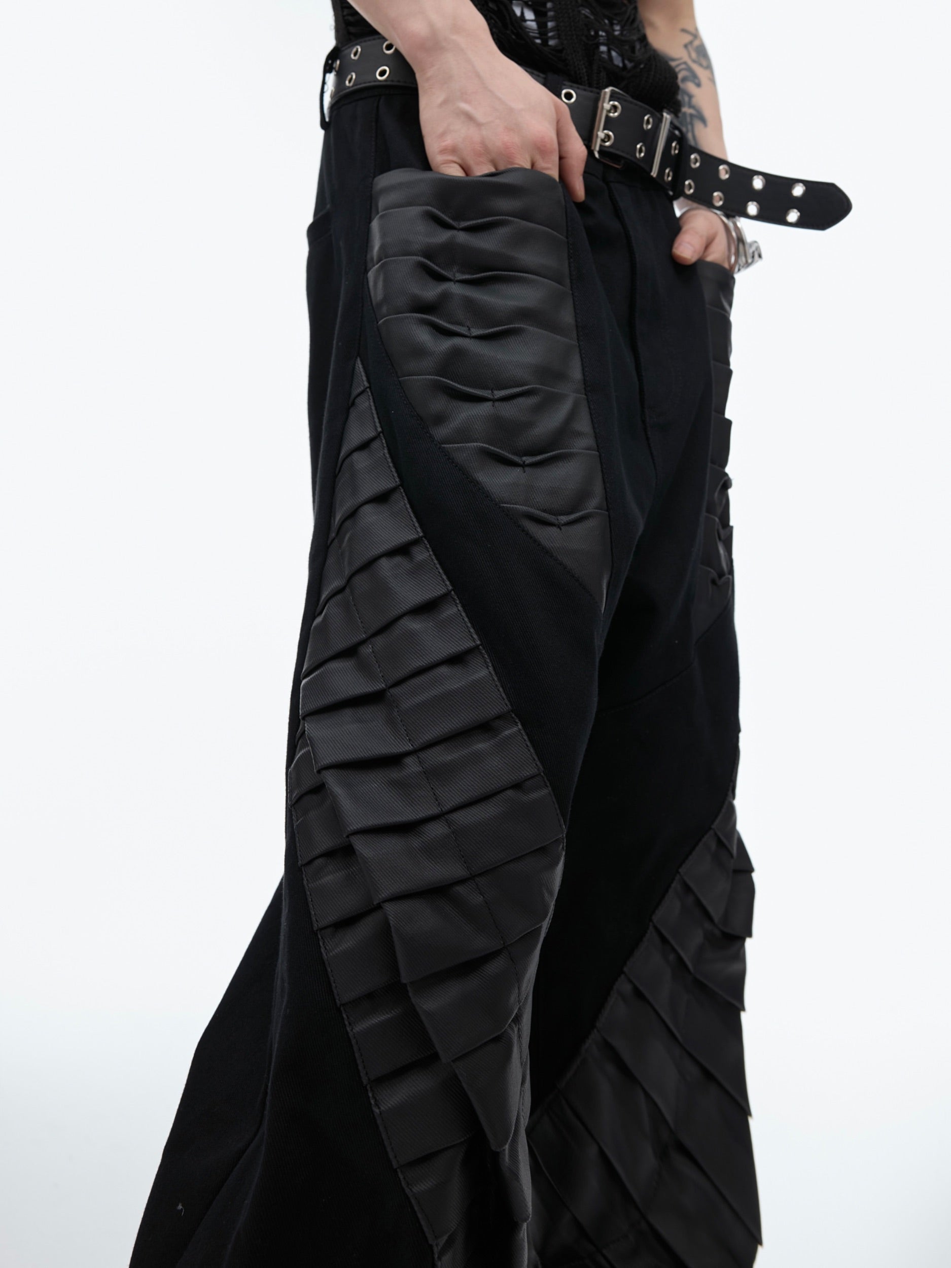 Rear view of fashion-forward oversized pants showcasing the pleated back design and urban aesthetic