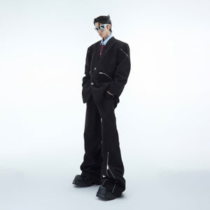 Front and back view of deconstructed wool trousers with unique zip detailing