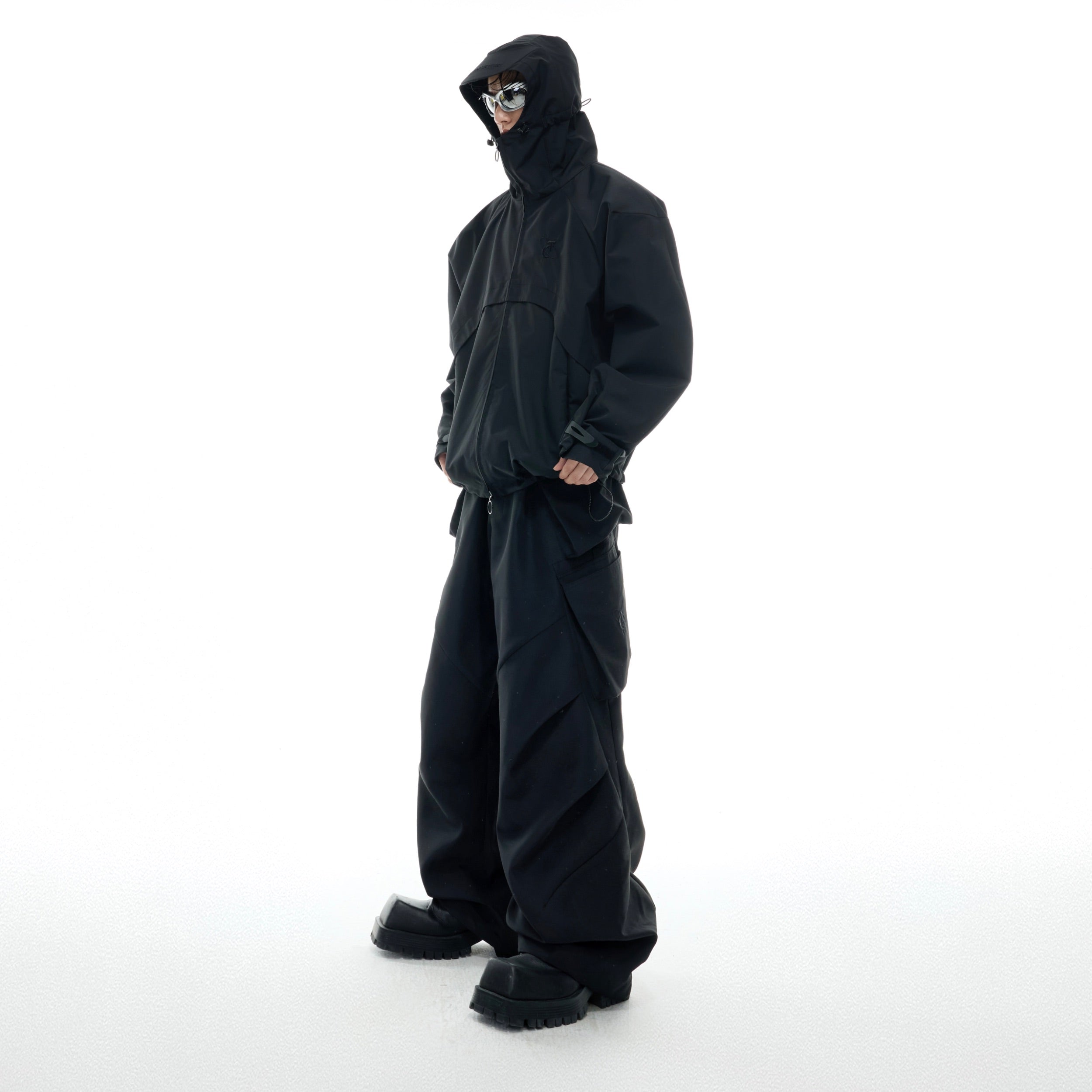 Back perspective of three-proof jacket featuring adjustable hood and reinforced stitching for durability