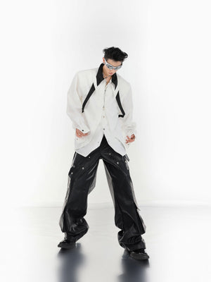 Front view of high-fashion tie shirt with bold color-block pattern and unconventional open front design