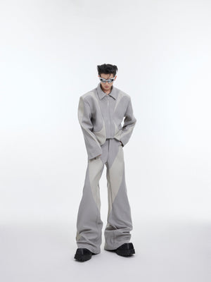 Side angle of twill blend leather trim suit showcasing the deconstructed shoulder pads and premium fabric texture