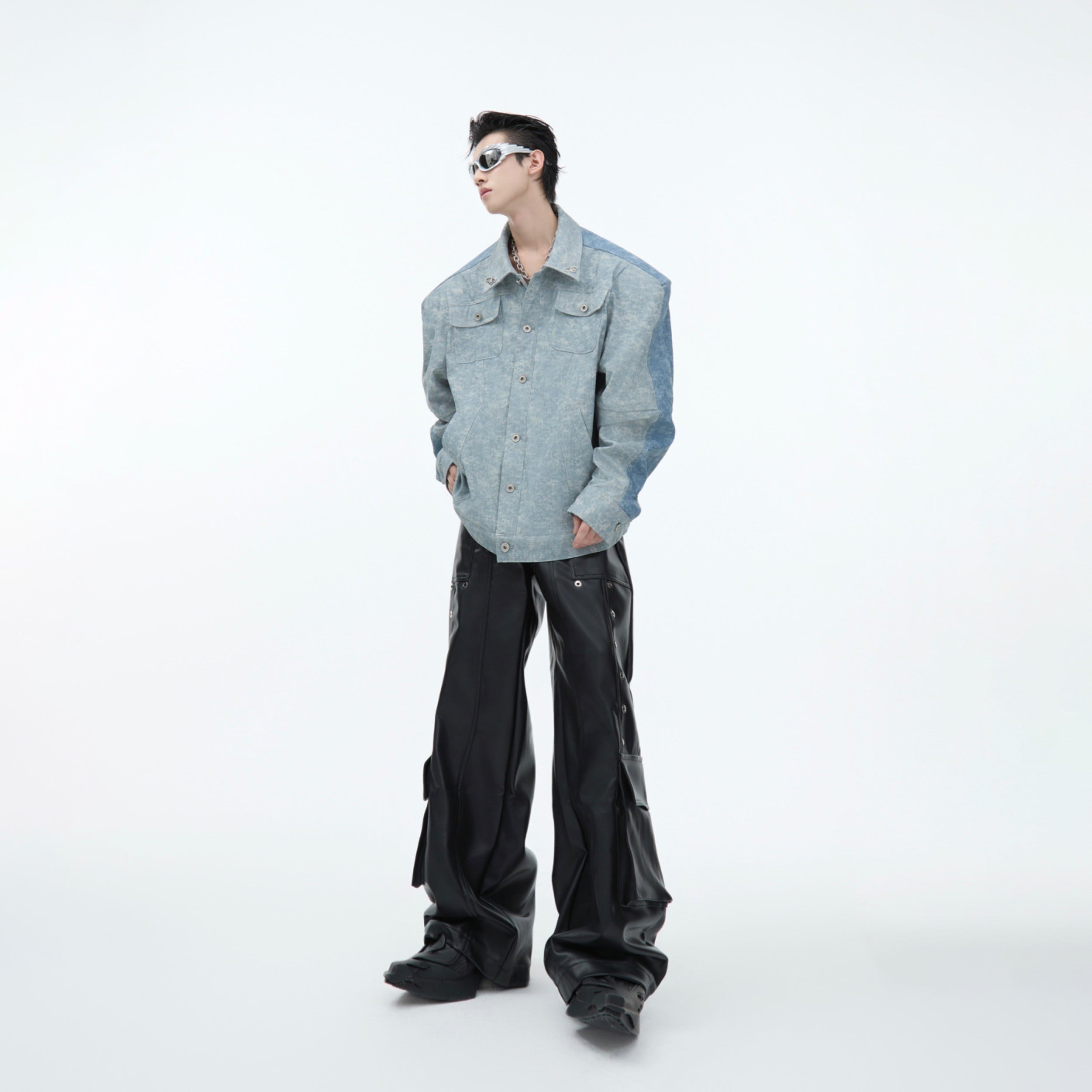 Detail shot showing the reversible double-sided feature of this premium denim-leather hybrid jacket