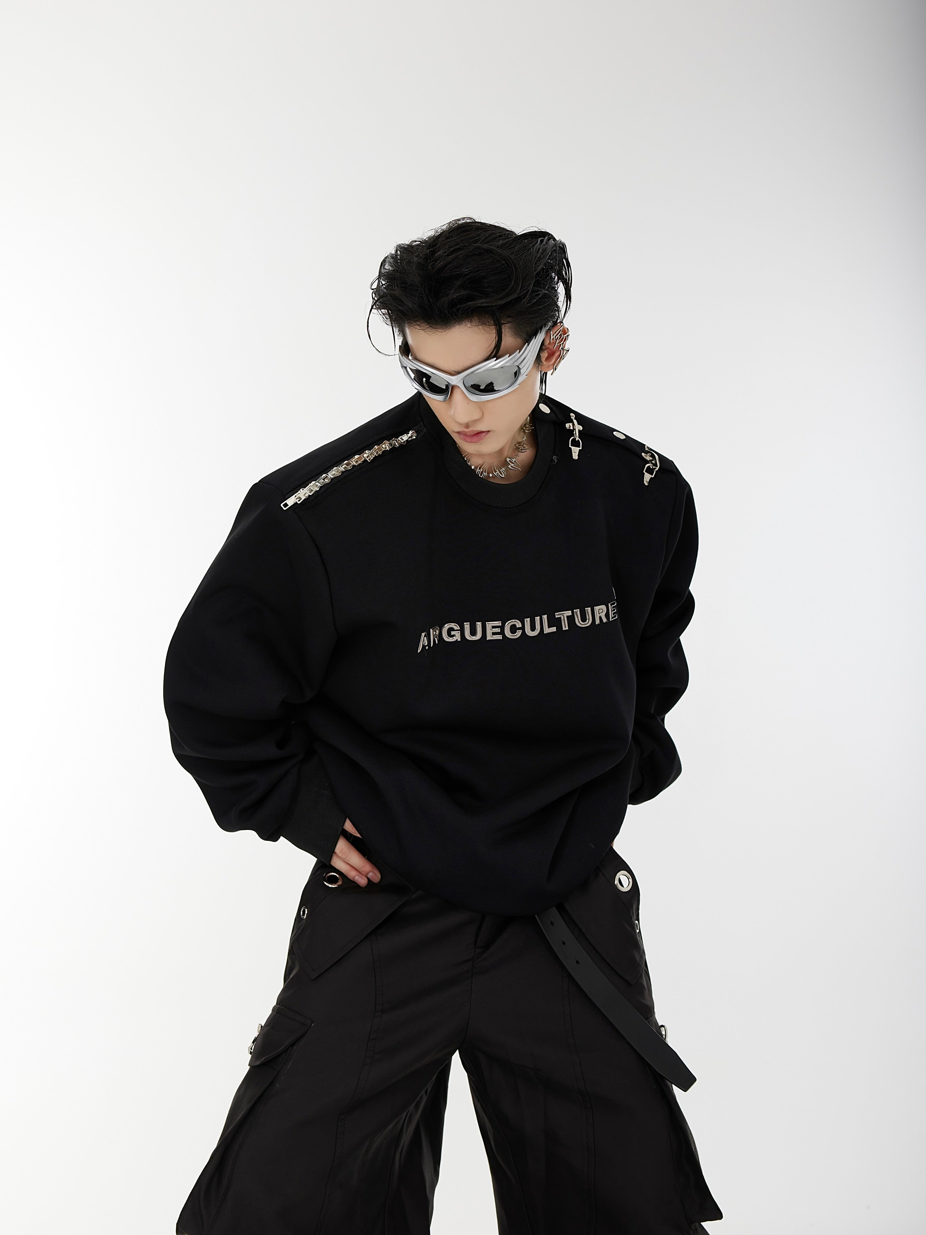Close-up of premium hoodie showing raised 3D logo print and metal-embossed streetwear branding