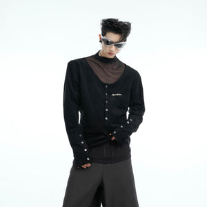 Front view of deconstructed long sleeve tee showing avant-garde patchwork design and button-up streetwear style