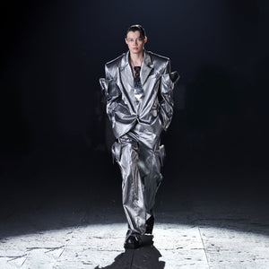 Stylish unisex model wearing the retro vertebrae necktie necklace with urban streetwear outfit for avant-garde look