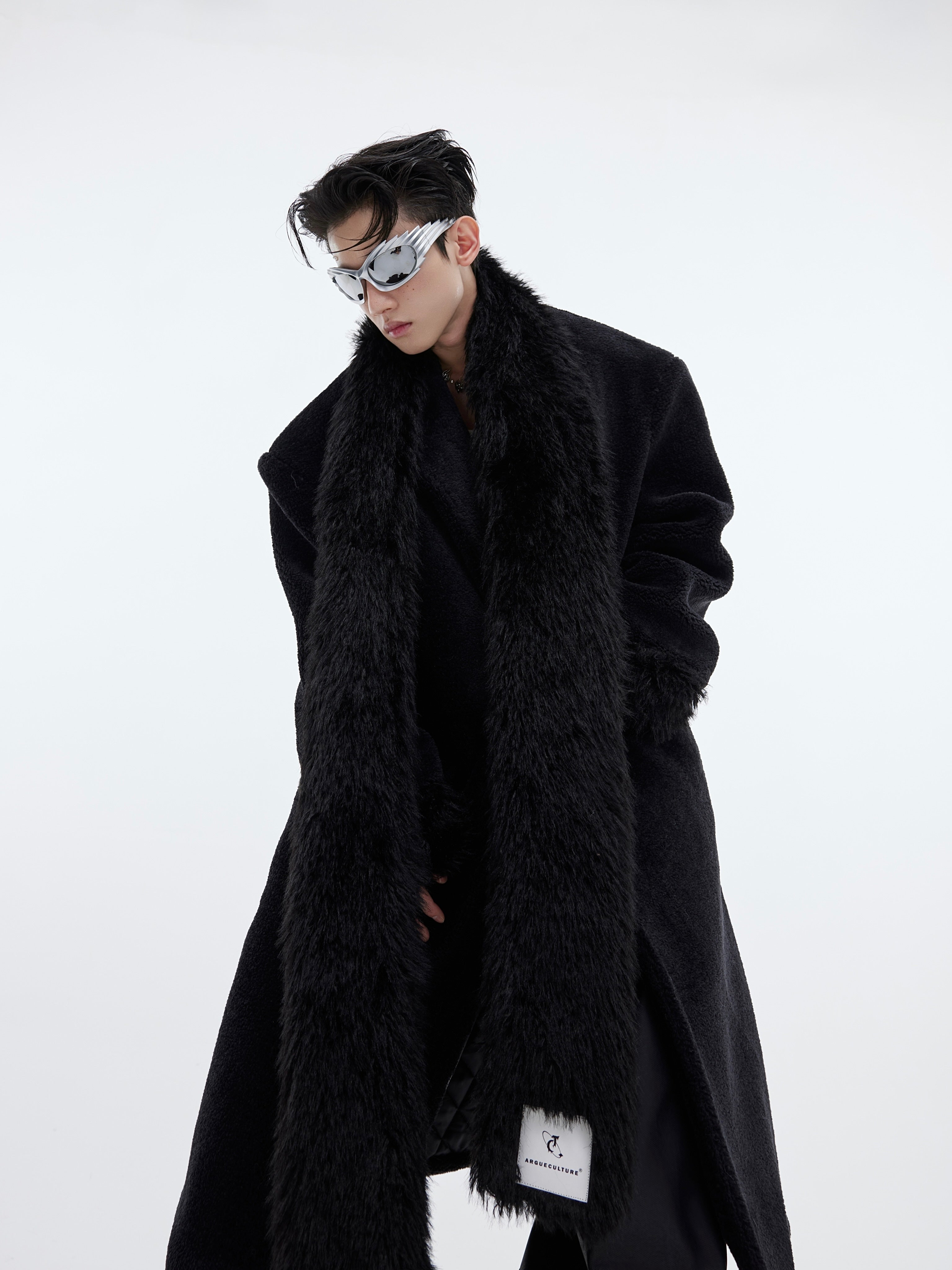 Back view of long plaid wool coat showcasing the unique deconstructed patchwork tailoring details