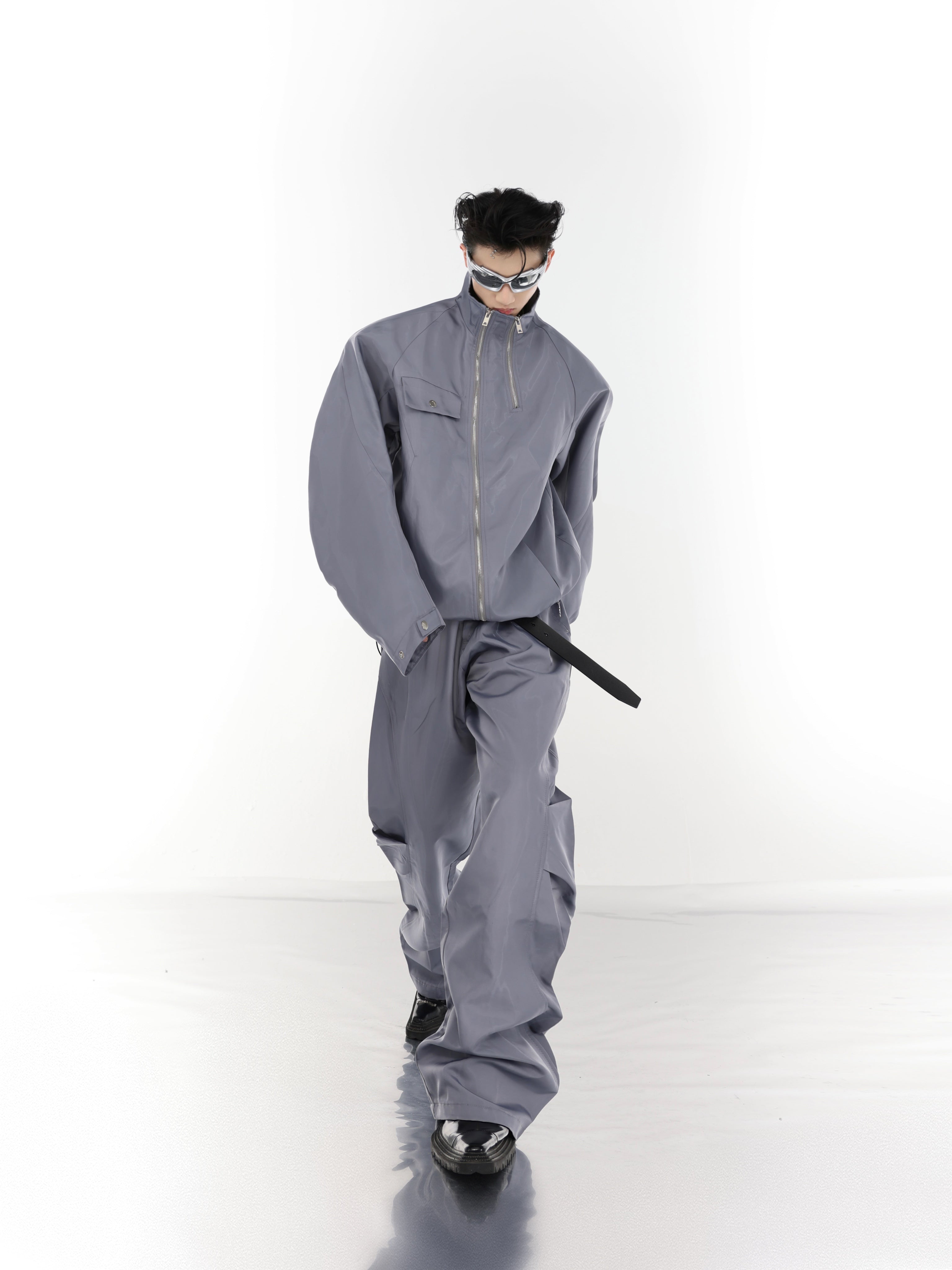 Side angle showing the wrinkle texture detail of this edgy windbreaker set with liquid-tech fabric