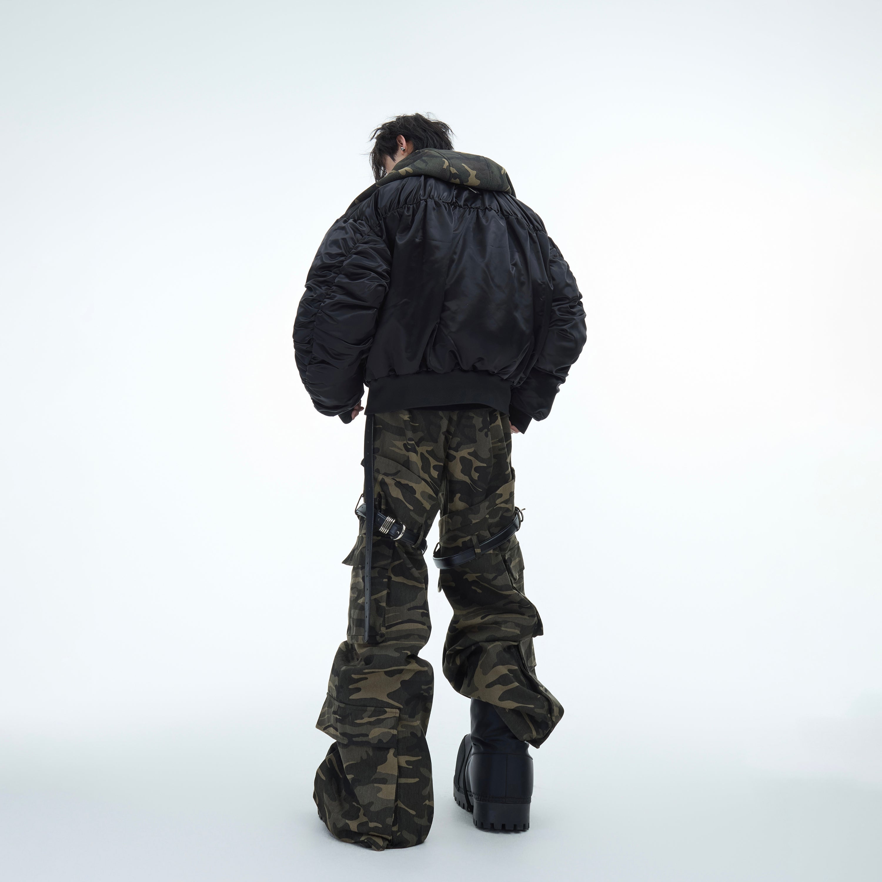Stylish full outfit featuring high-waisted camouflage cargo pants paired with urban streetwear