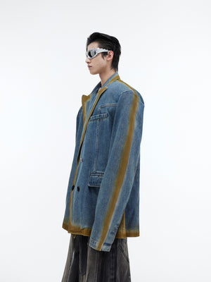 Vintage washed denim blazer with unique gradient spray-paint effect and structured shoulders