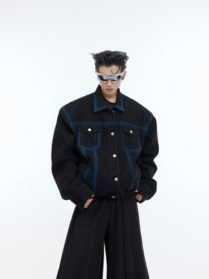 Back view showing unique niche-dye technique on this deconstructed short denim jacket with rugged charm