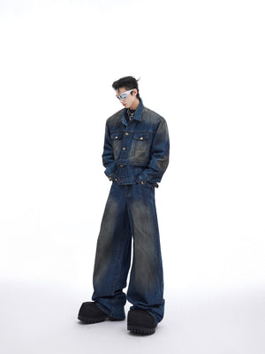 Front view of vintage distressed denim jacket with raw edges and deconstructed details, paired with baggy pants