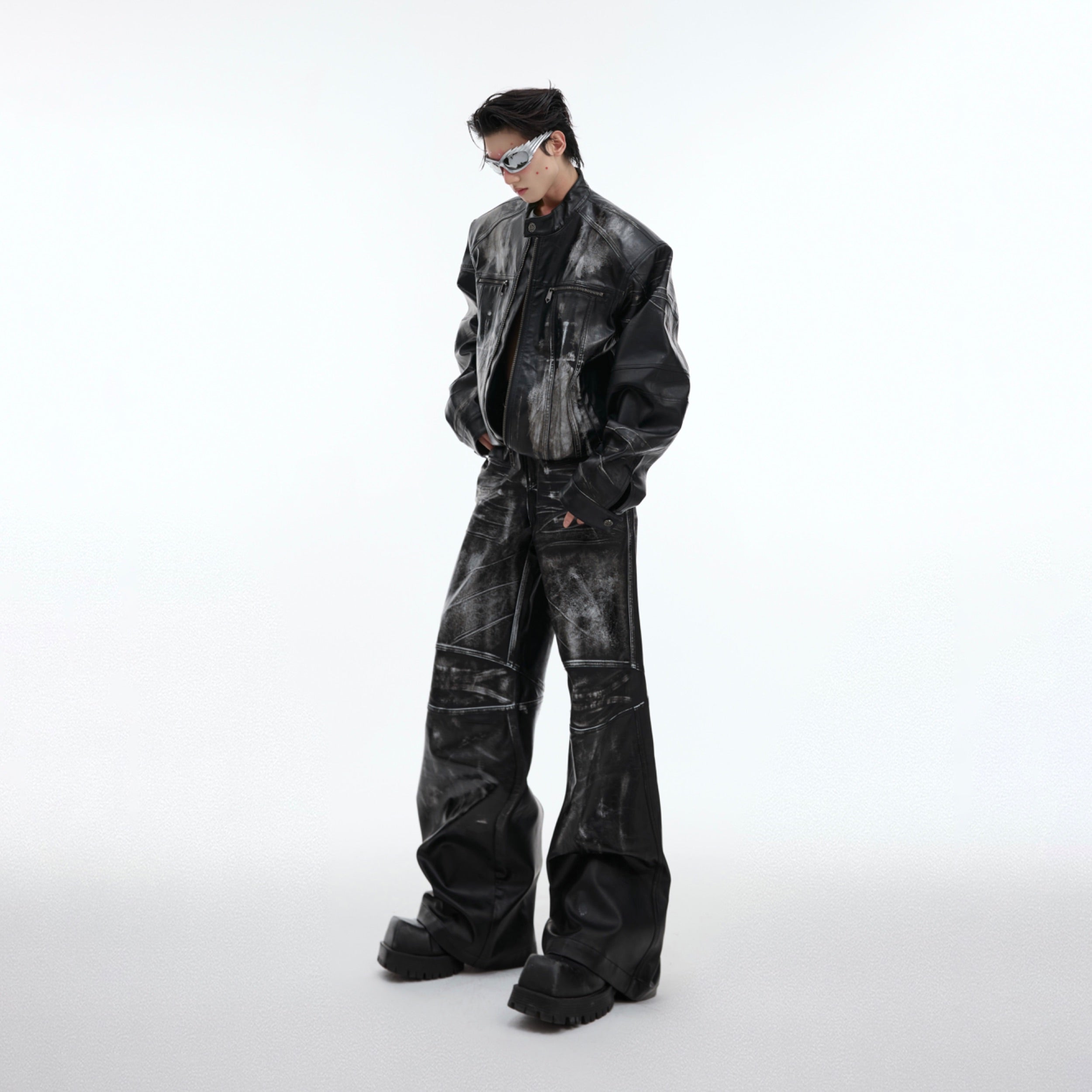 Vintage distressed oversized biker jacket in deconstructed heavy polish leather, featuring unique hand-distressed textures