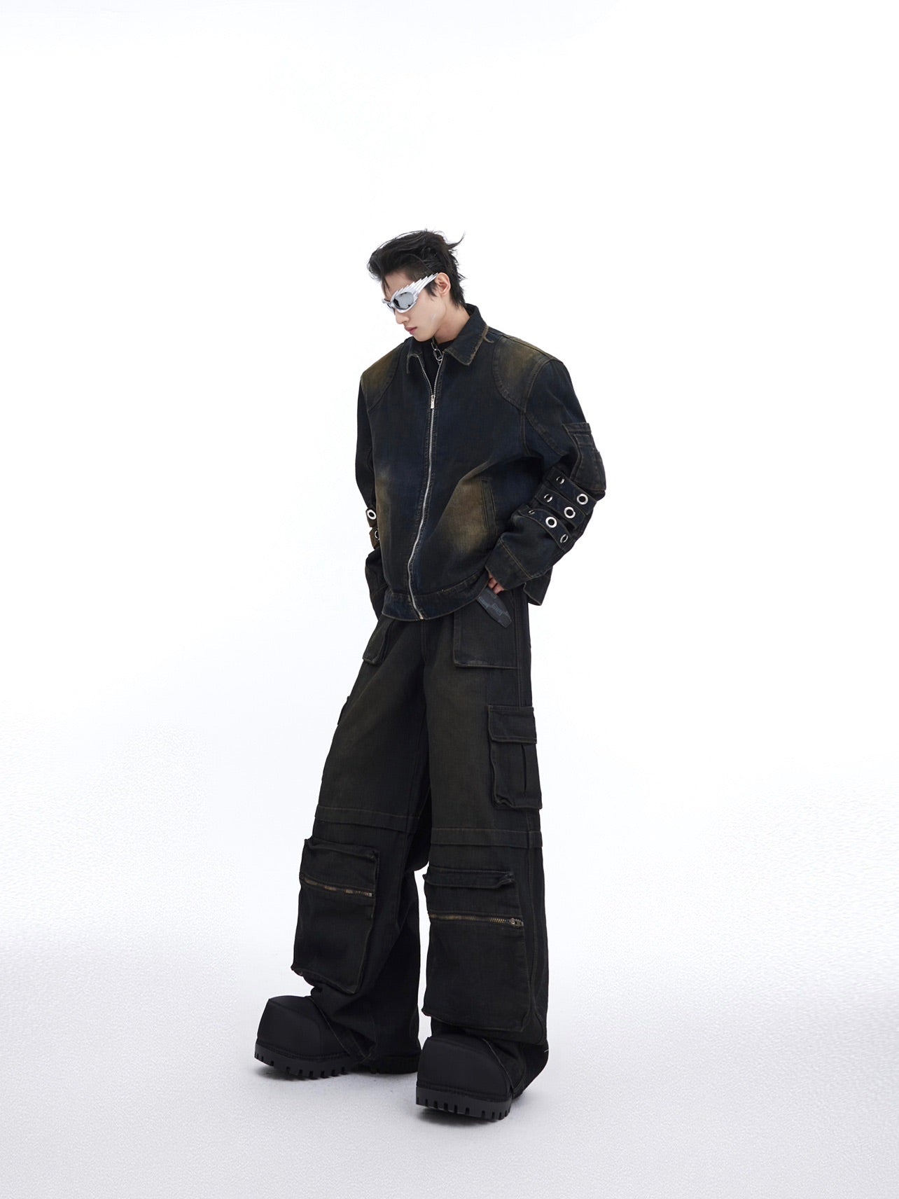 Vintage distressed denim zip-up jacket with patchwork details and metal accents for urban streetwear style