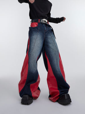 Vintage washed distressed denim jeans with deconstructed PU patchwork details and bold color-blocking design