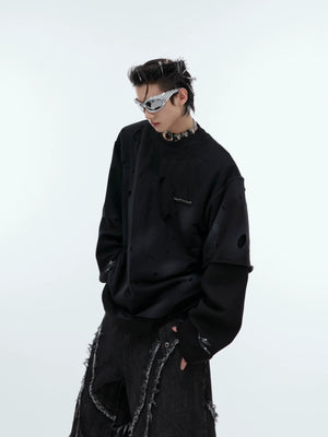 Vintage washed distressed long-sleeve hoodie with striking metal logo detail, perfect for urban streetwear looks