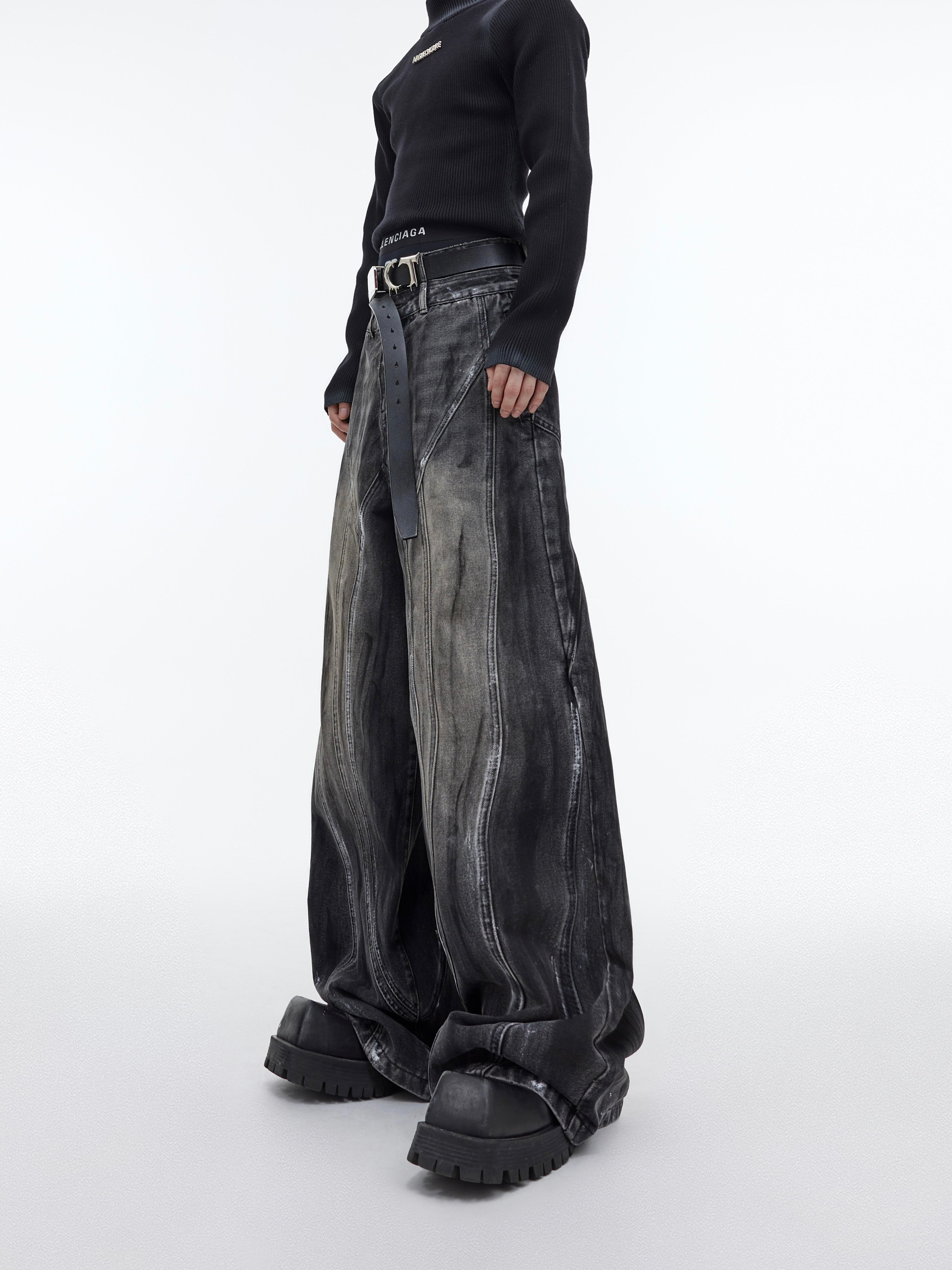 Vintage distressed wide-leg jeans featuring handpainted details and high-waisted design for urban streetwear looks