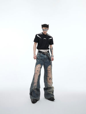 Styling example showing how these distressed hollow-out flared jeans fit with urban streetwear aesthetic