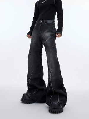 Vintage washed distressed flared jeans with bold metal zipper detailing, showcasing unique paint splatter effects for streetwear style