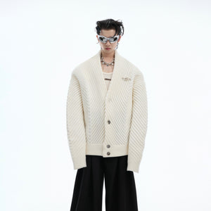 Oversized v-neck knit sweater with thick ribbed texture, perfect for vintage streetwear looks