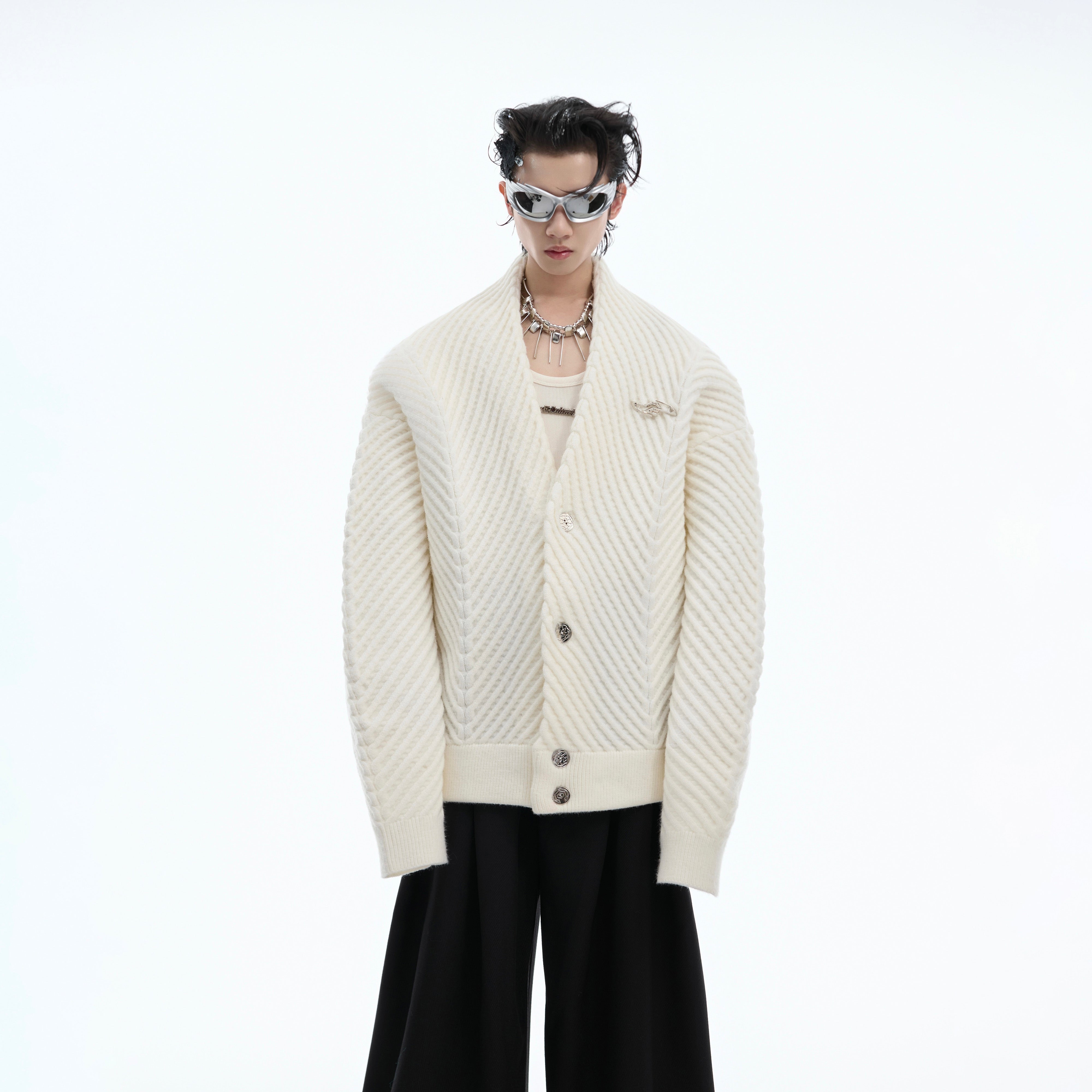 Oversized v-neck knit sweater with thick ribbed texture, perfect for vintage streetwear looks