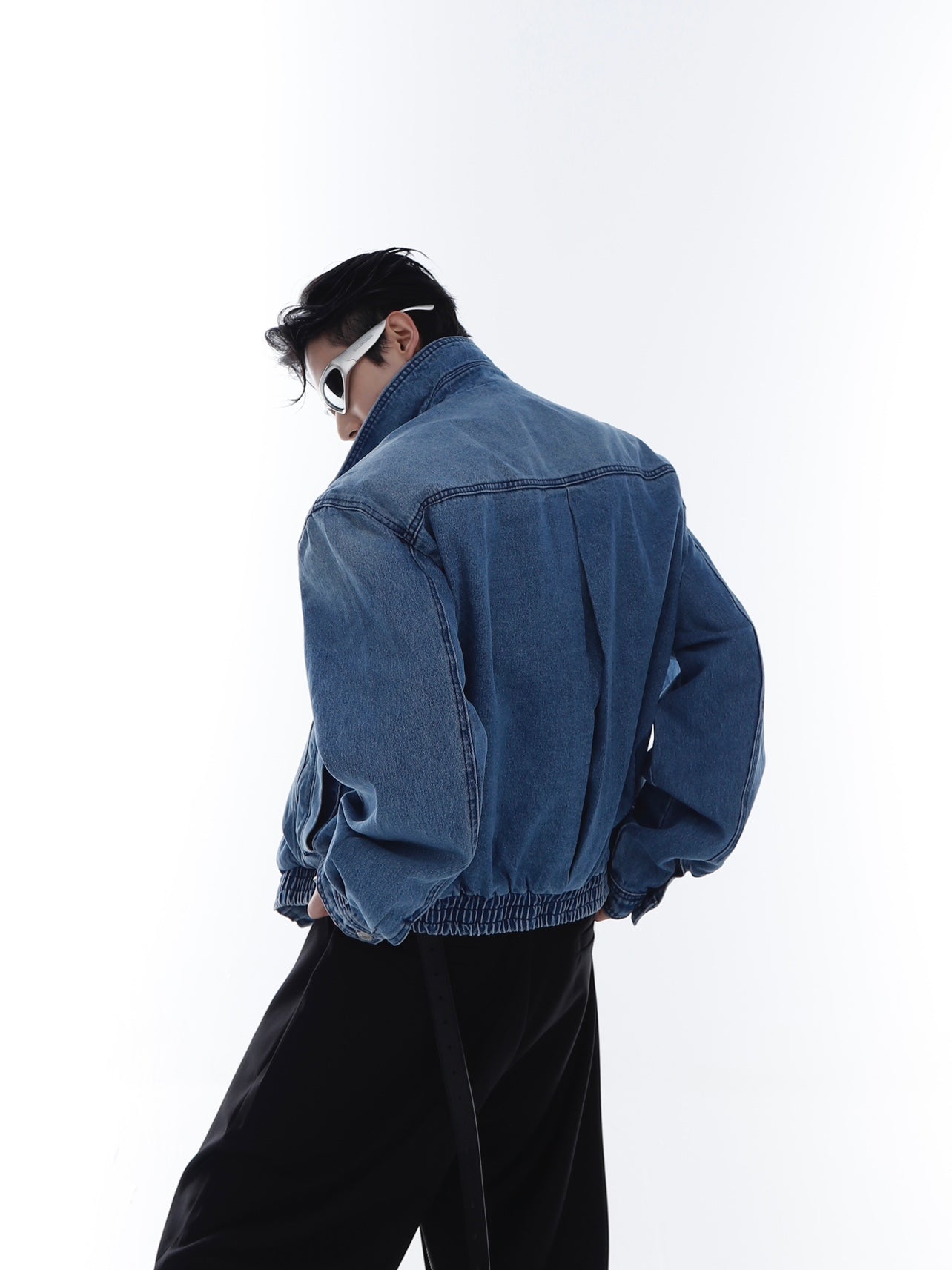 Model wearing the vintage washed denim jacket demonstrating its cropped oversized fit for urban fashion