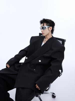 Back view of deconstructed white blazer showing unique tailoring and modern suiting silhouette