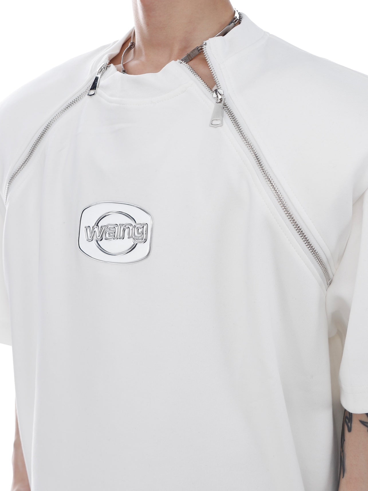 Close-up of the architectural silhouette showing 3D advanced cutting technique on this unisex statement tee